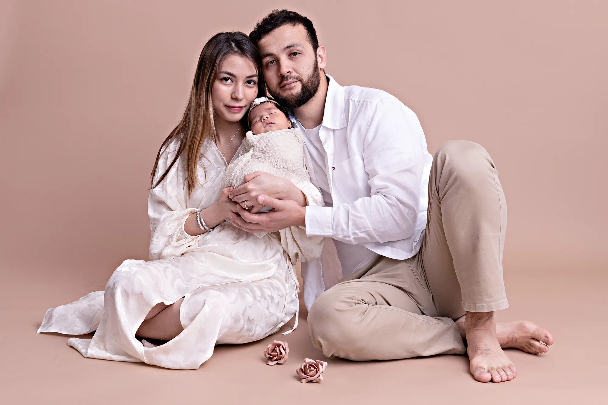 Family of three enjoying studio session at Sky Portraits, Sydney - fun family photographer