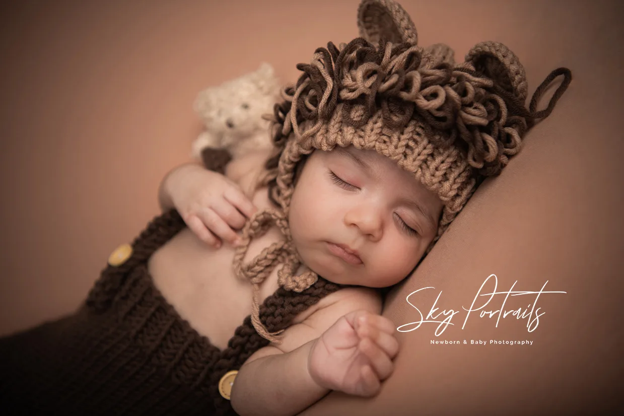 Newborn baby girl with floral headband at Sky Portraits, Sydney - baby photographer