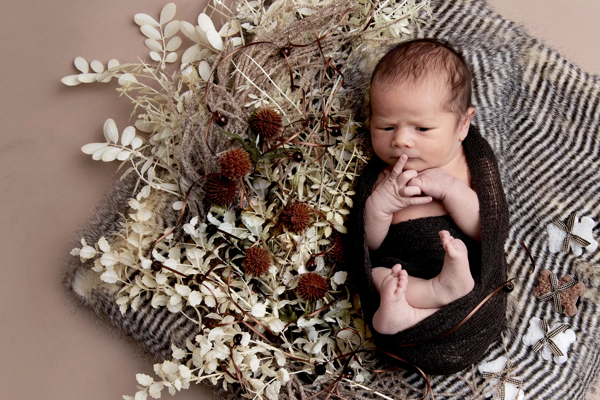 Seasonal newborn shoot with autumn leaves at Sky Portraits, North Shore, Sydney - seasonal newborn photography