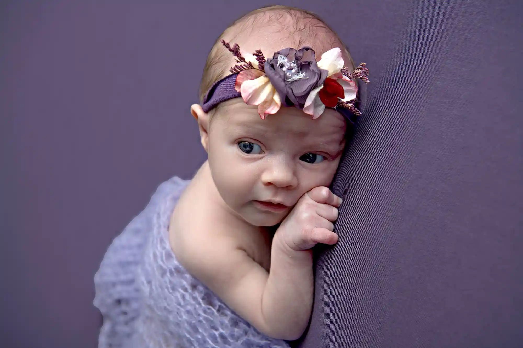 Serene newborn wrapped in natural tones at Sky Portraits, Sydney - newborn photography session