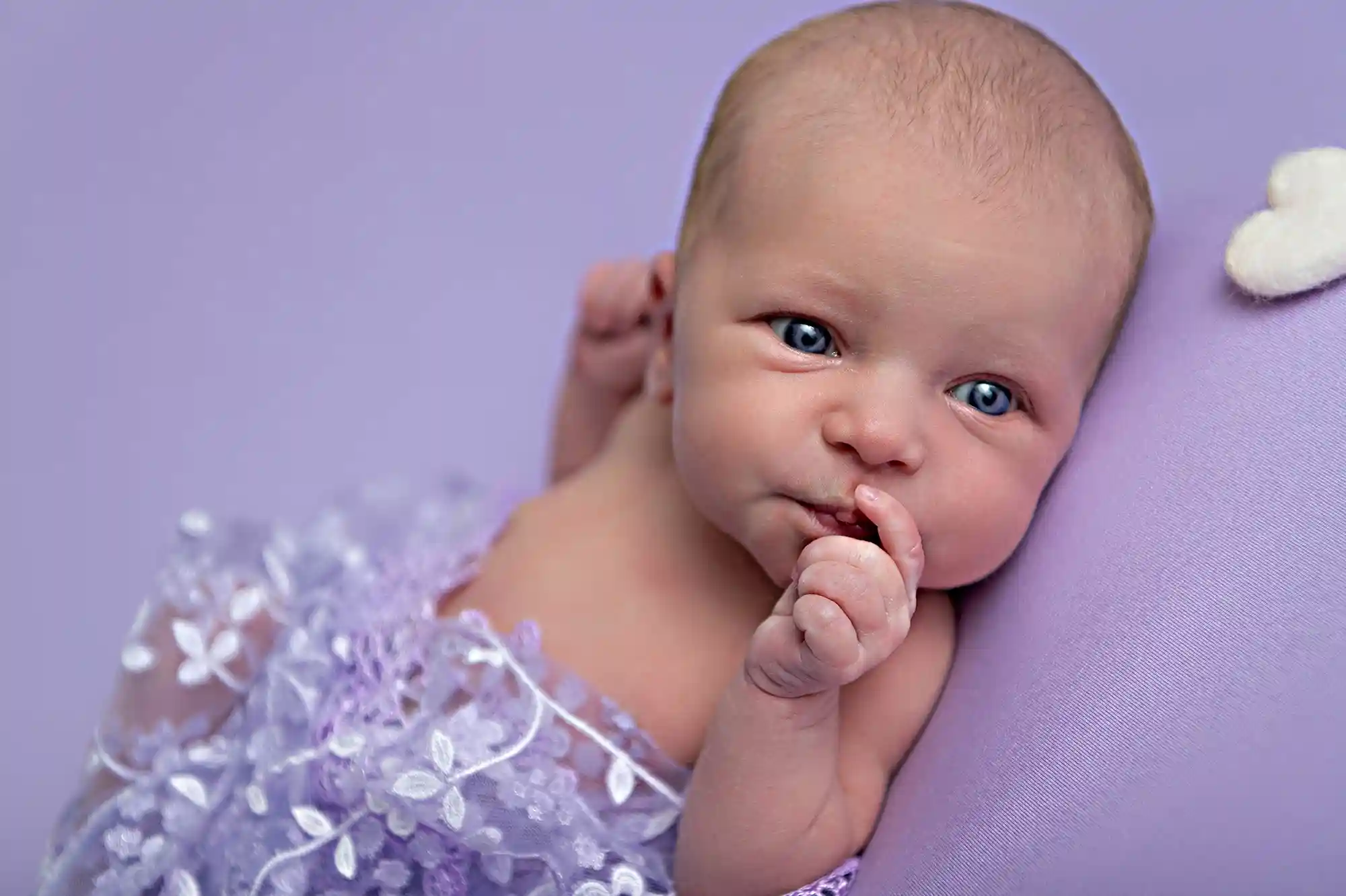 Newborn baby cradled gently at Sky Portraits Studio, Sydney - newborn photography