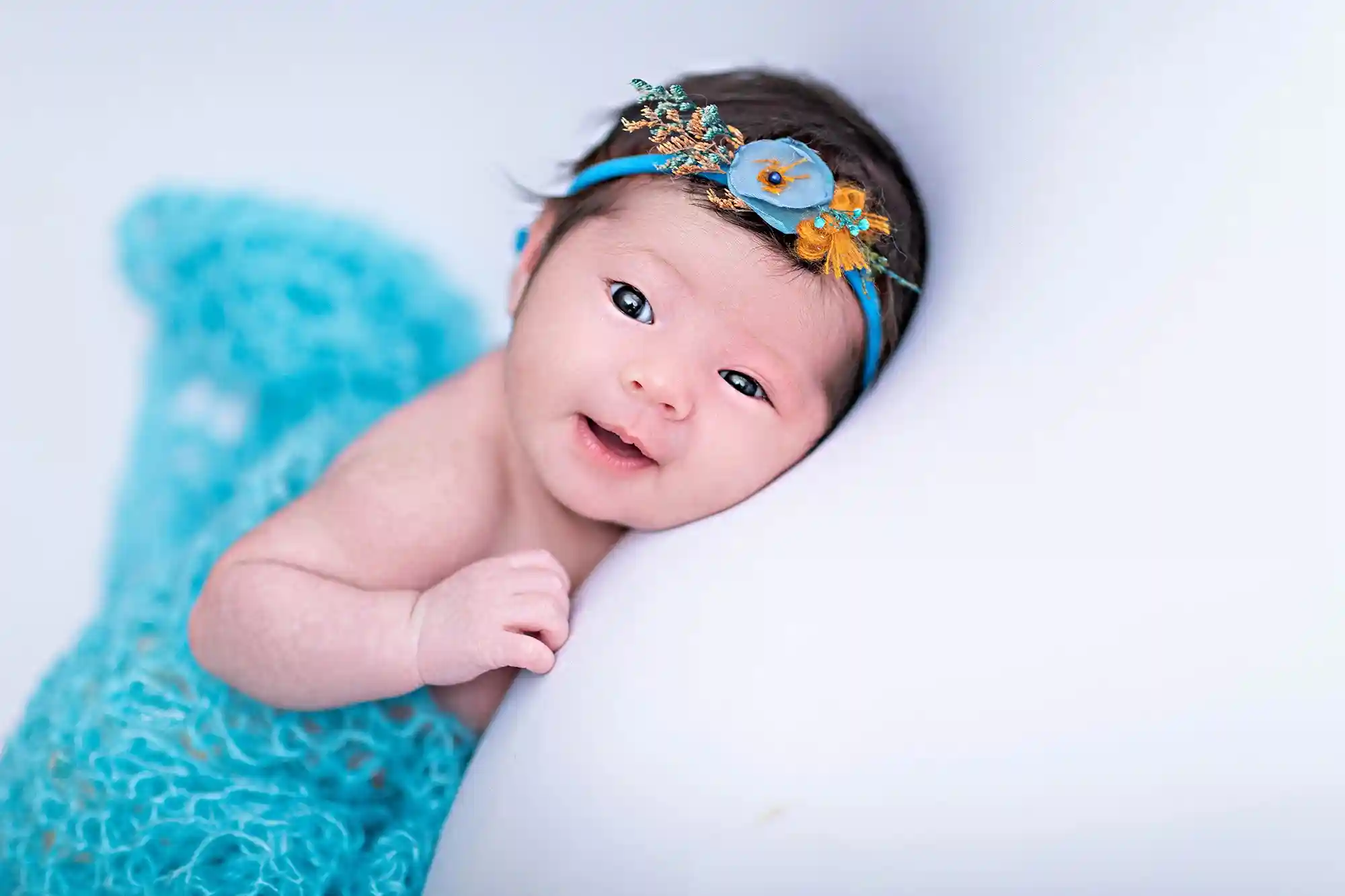 Cherubic newborn pose with plush toys at Sky Portraits, Sydney - baby photography
