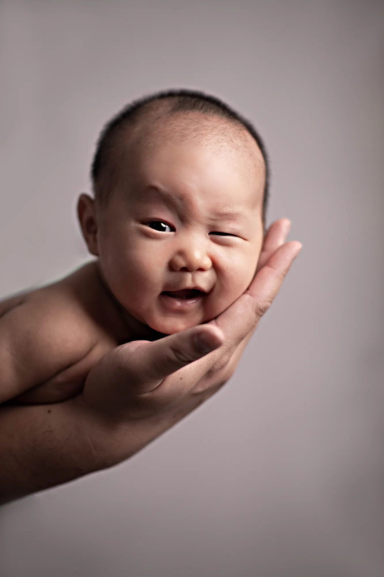 Close-up of newborn's smile at Sky Portraits Studio, Sydney - newborn photography specialist